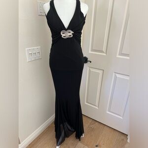 Formal Cache stretch fabric with jeweled detail.  Gorgeous deep v back.